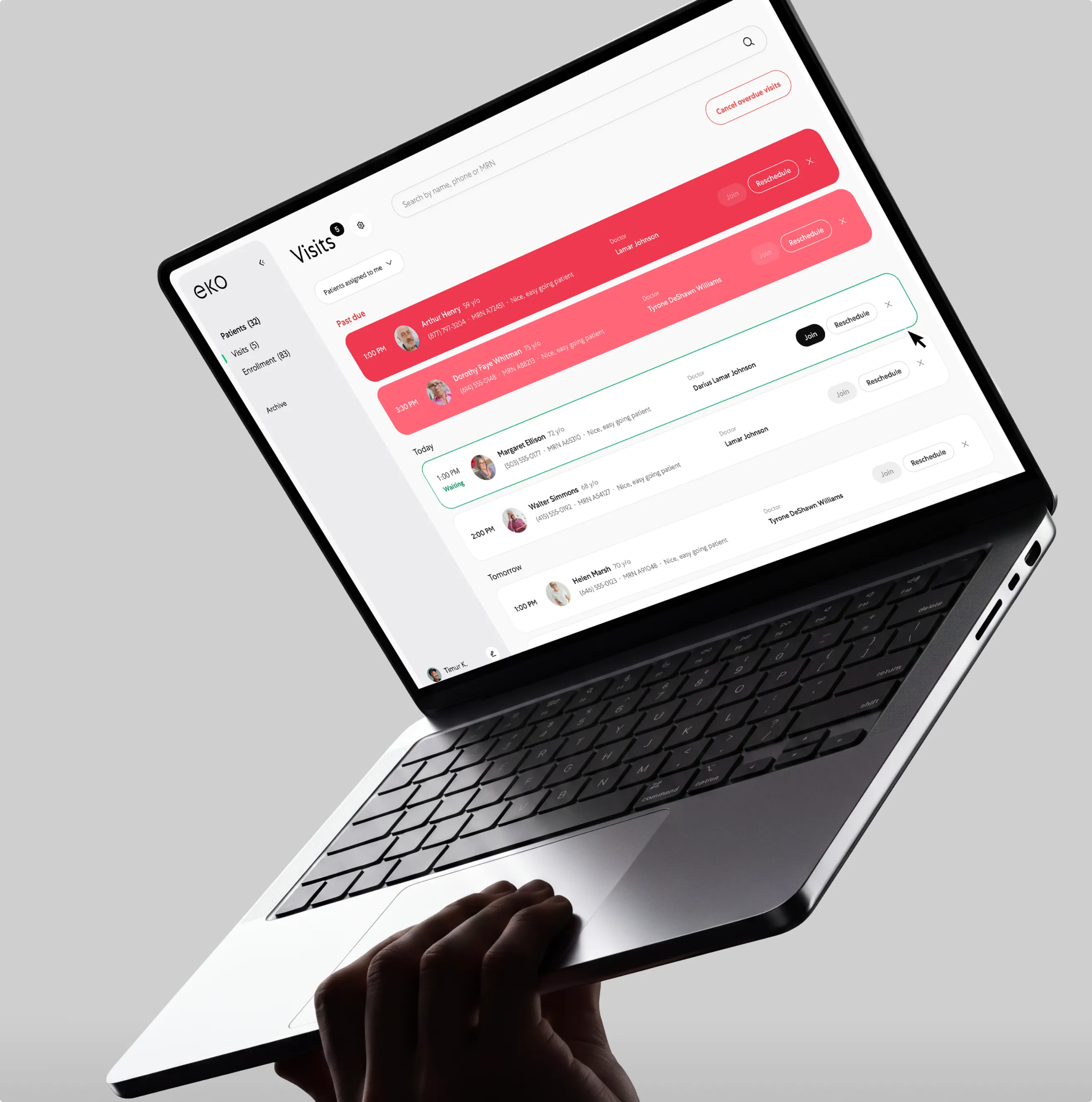 Laptop held in a hand showing the Eko Visits dashboard — a scheduled patient-visit list — on a light gray background