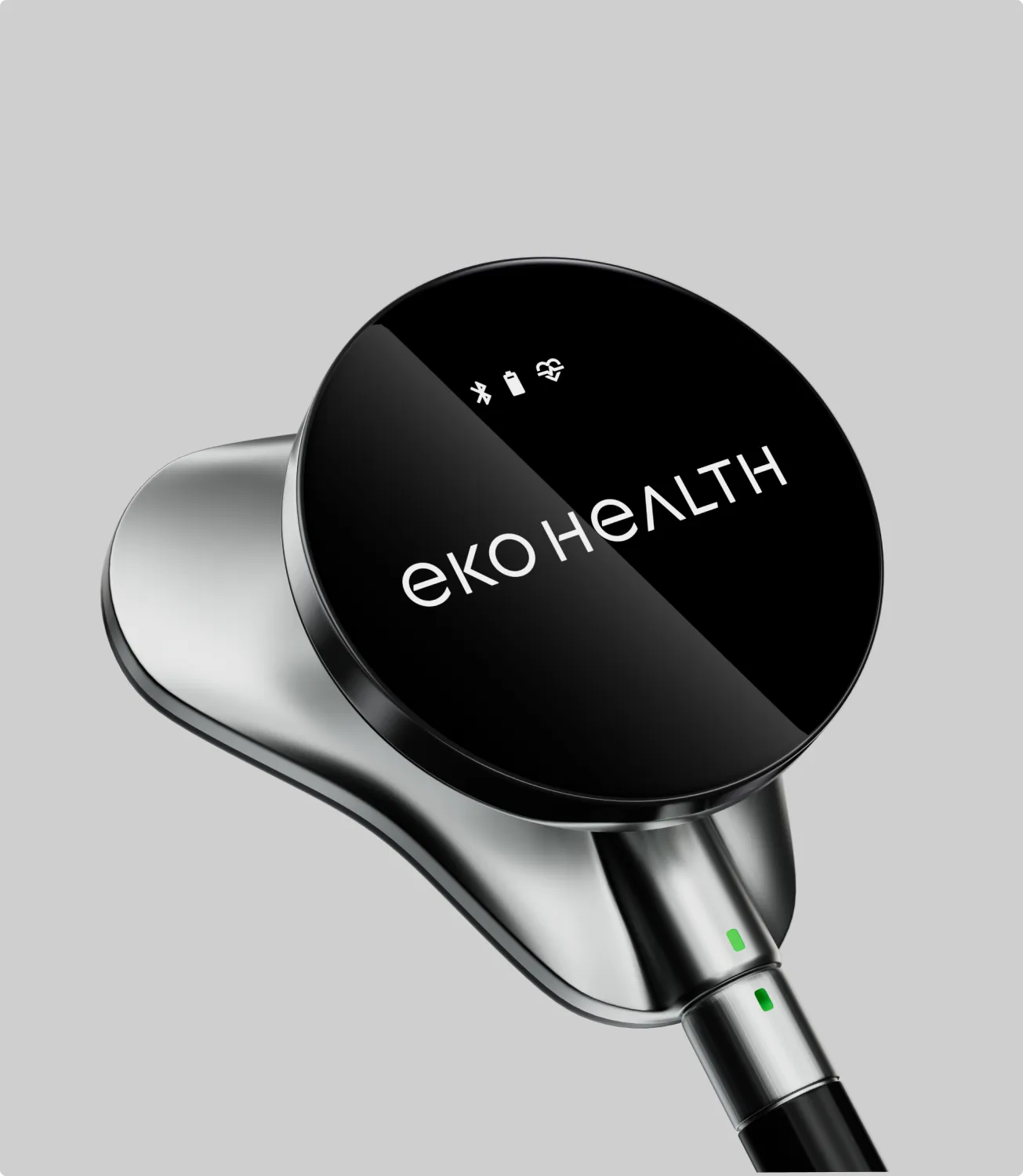 Close-up of the Eko HEALTH stethoscope chestpiece with the wordmark, on light gray