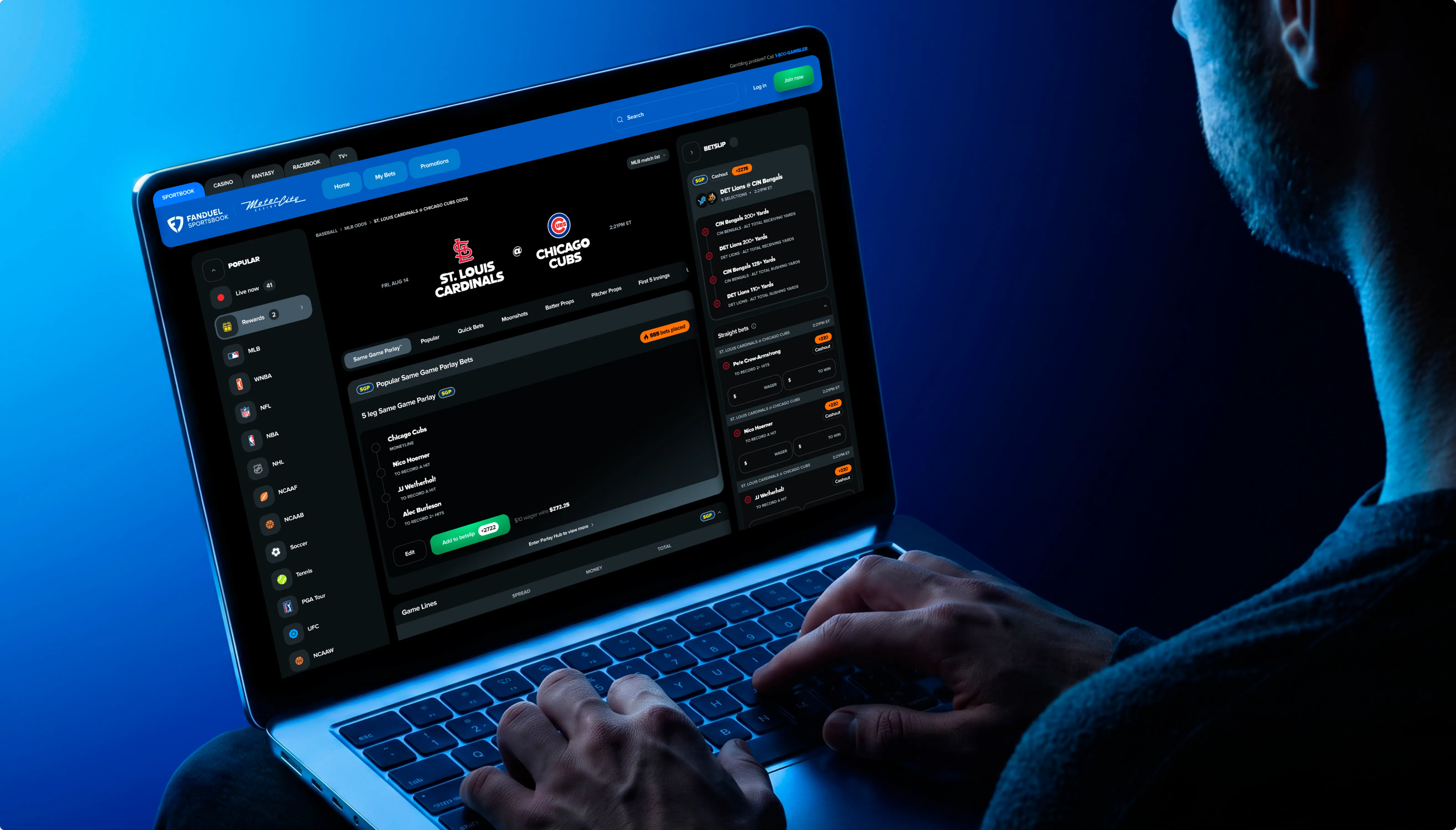 A person at a laptop working through a live baseball game page on the FanDuel desktop sportsbook