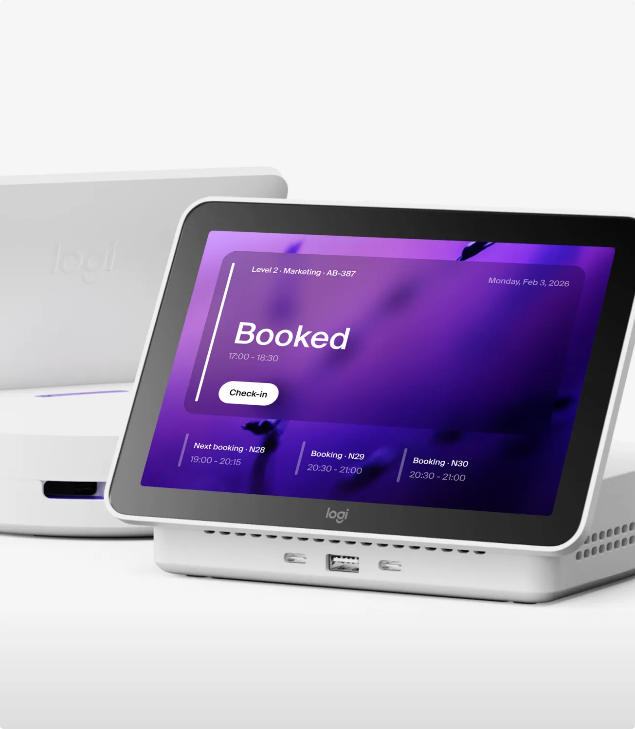 Two Logi Dock Flex units, the front one showing 14:37 on a purple screen