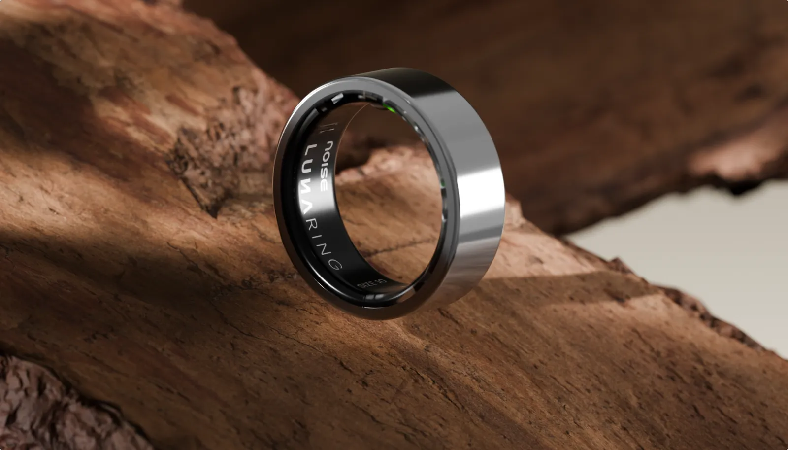 Silver Luna Ring resting on a piece of weathered wood