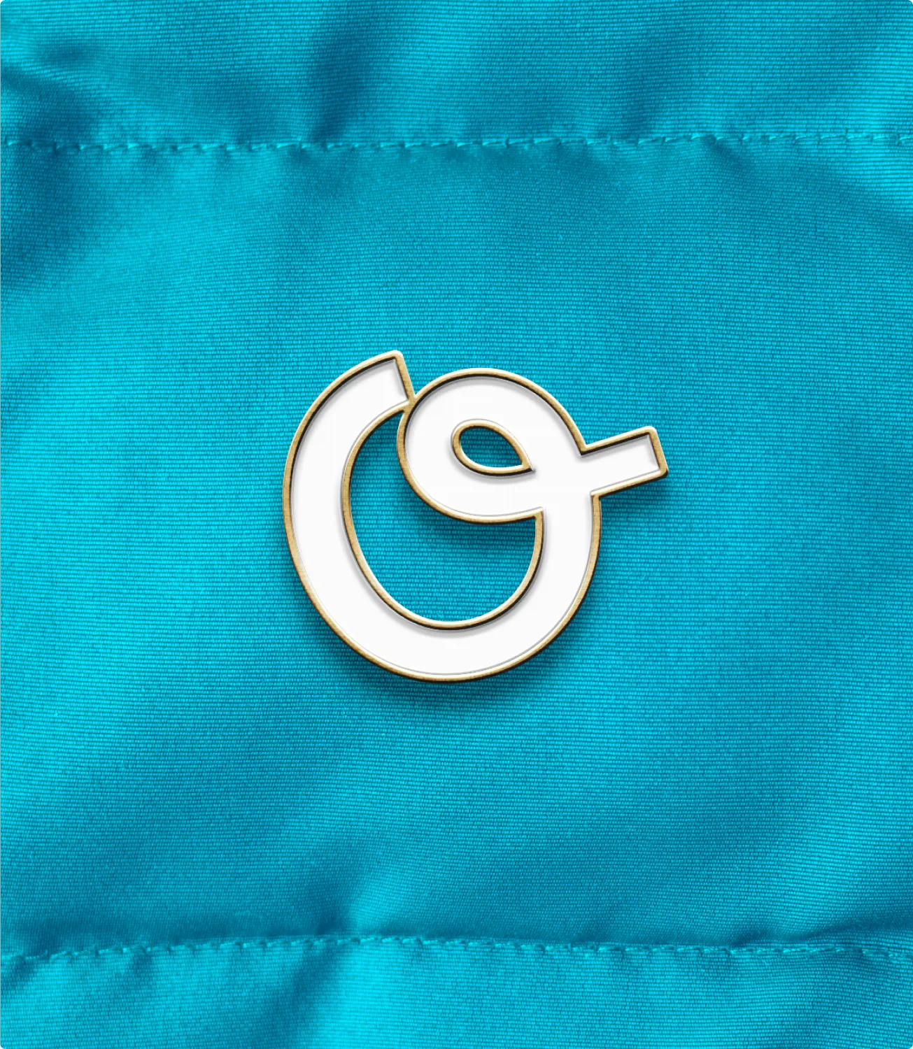 Offered logo pin on fabric