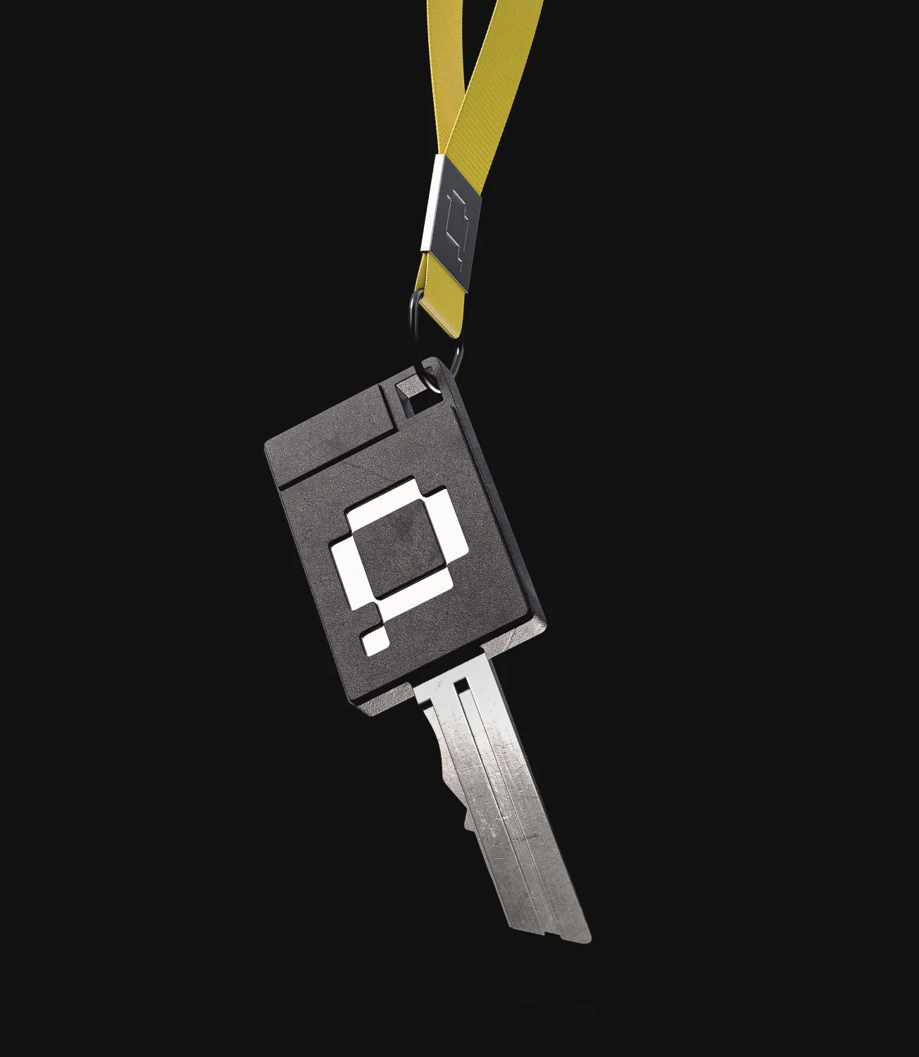 Black Quipli key fob on a yellow lanyard against a black background