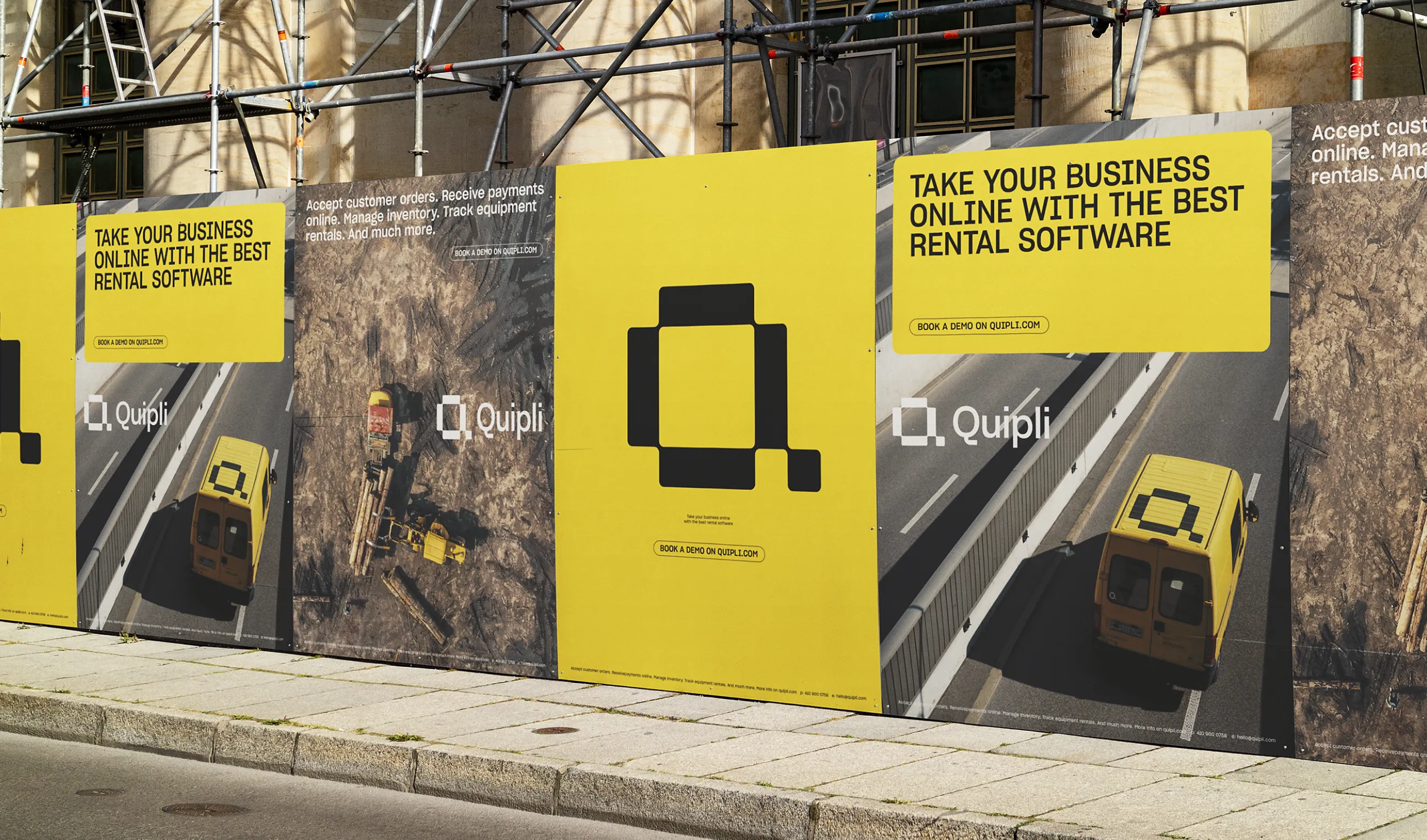 Yellow Quipli outdoor advertising hoarding on a scaffolded building reading Take your business online with the best rental software