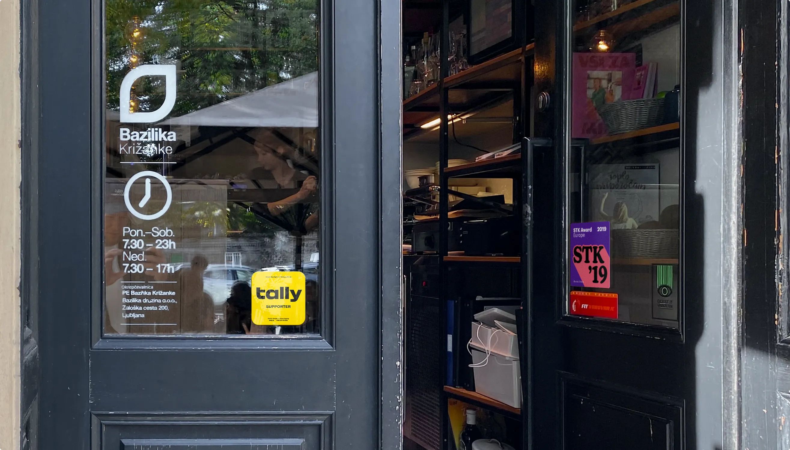 Tally sticker on a cafe storefront glass door