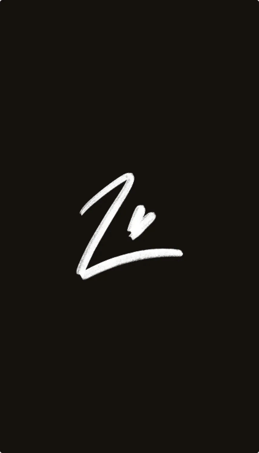 Lexi’s mark in white on black: a single handwritten letter with a heart