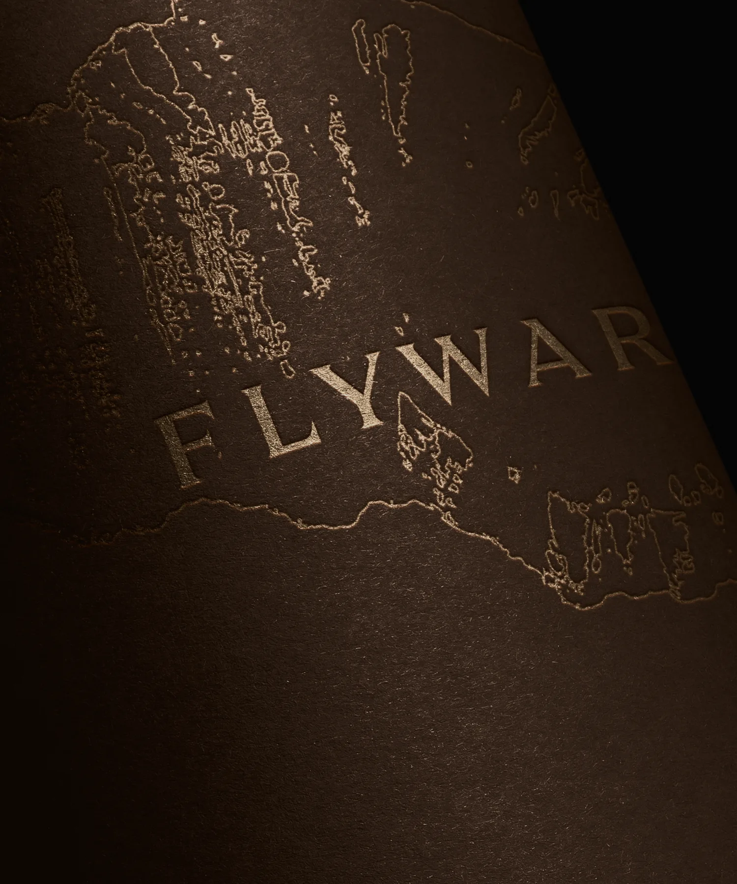 Flyward wordmark embossed on a dark surface